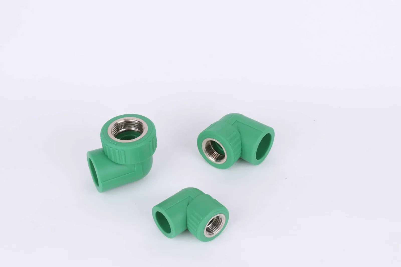 Three green PP-R elbows with metal female threaded inserts